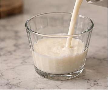 Cream poured into a small glass