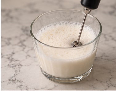 Cream frothed with a handheld frother