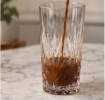 Chai concentrate poured into a tall glass